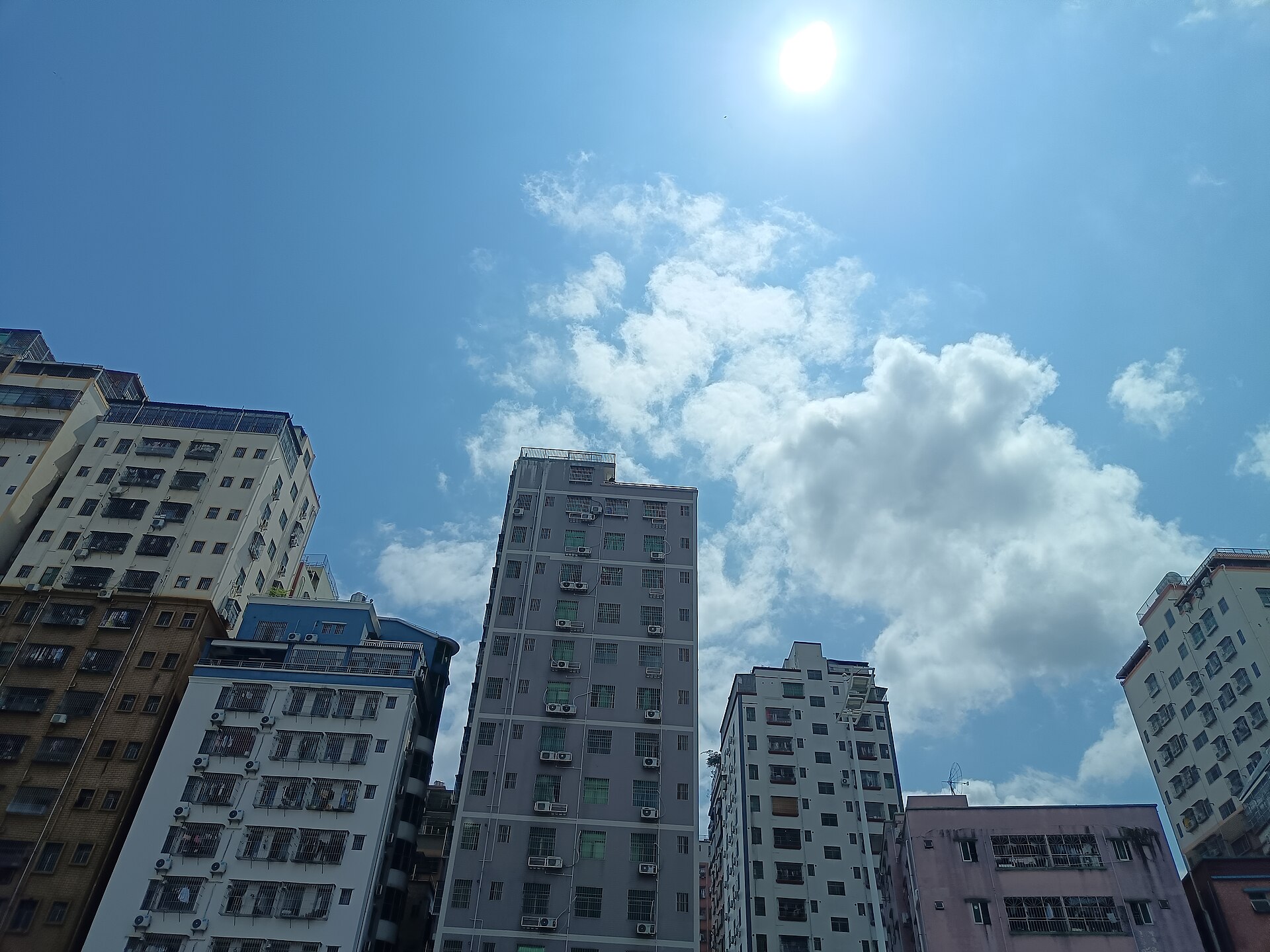 Apartment blocks in Shenzhen, photographed looking up on 27 March 2025.
